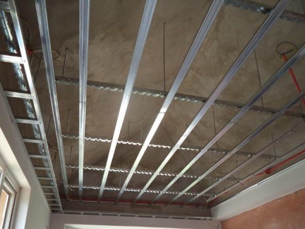Metal ceiling grid framework with conduit runs ready for boarding