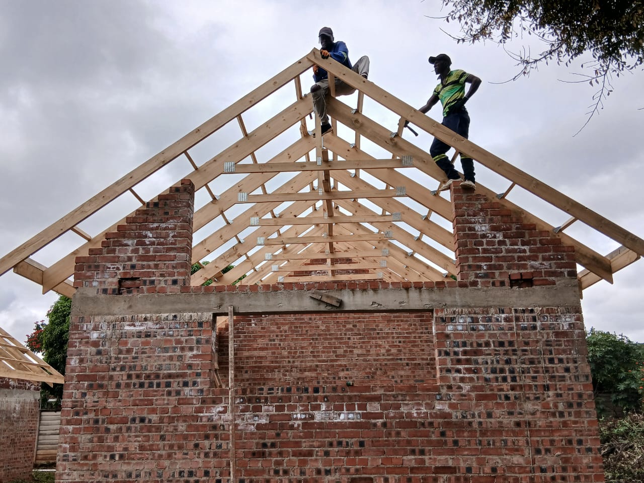 Roof trusses being erected on a large residential build in progress